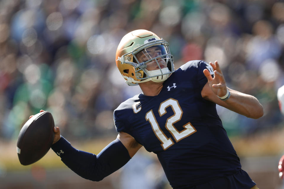 Notre Dame quarterback Ian Book throws in the first half of an NCAA college football game against New Mexico in South Bend, Ind., Saturday, Sept. 14, 2019. (AP Photo/Paul Sancya)