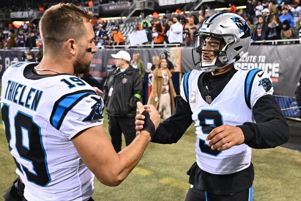 Nov 9, 2023; Chicago, Illinois, USA; Carolina Panthers wide receiver Adam Thielen (19) and quarterback Bryce Young (9) shake hands as they head to the locker room after pregame warm ups before playing the Chicago Bears at Soldier Field. Mandatory Credit: Jamie Sabau-USA TODAY Sports