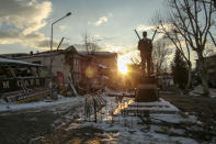 Collapsed houses and a standing statue of Mustafa Kemal Ataturk, founder of modern Turkey, in Golbasi, in Adiyaman province, southern Turkey, Wednesday, Feb. 8, 2023. Thinly stretched rescue teams worked through the night in Turkey and Syria, pulling more bodies from the rubble of thousands of buildings toppled by a catastrophic earthquake. The death toll rose Wednesday to more than 10,000, making the quake the deadliest in more than a decade. (AP Photo/Emrah Gurel)