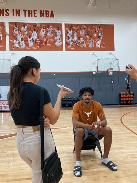 Texas basketball player Ithiel Horton, who arrived via the transfer portal this offseason, said this week that the banner behind him at Cooley Pavilion serves as an inspiration during practice. It shows all the UT players who have been drafted in the NBA.