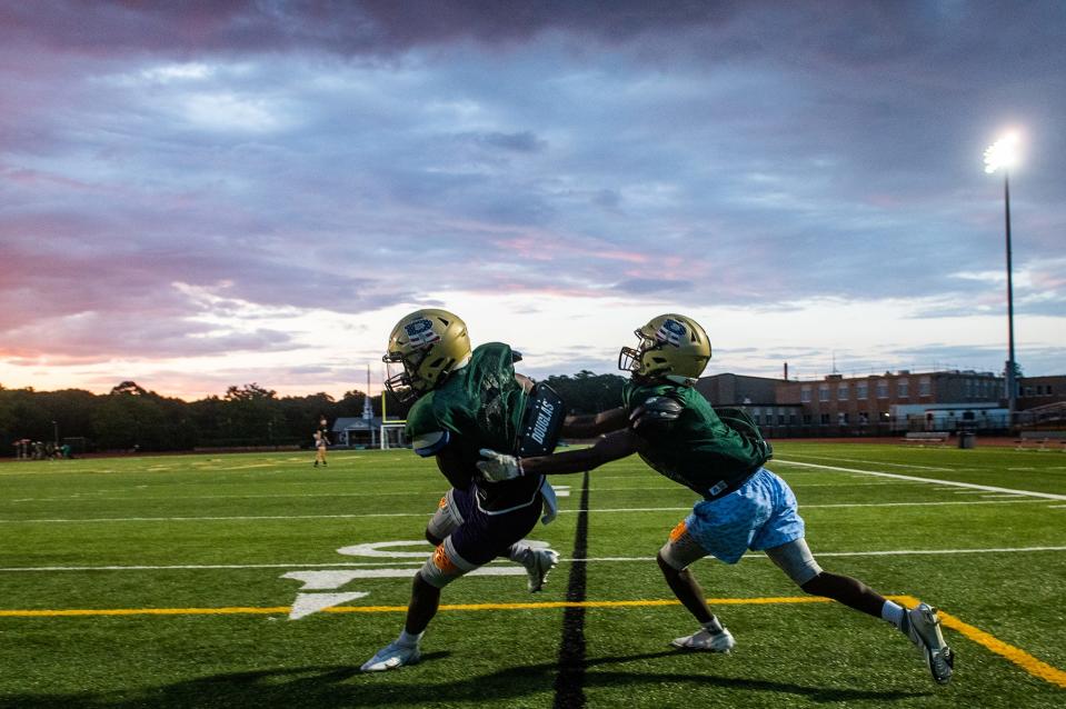 Presley Kafero, left, gets tackled during football practice at FDR High School in Staatsburg, NY on Wednesday, August 24, 2022. KELLY MARSH/FOR THE POUGHKEEPSIE JOURNAL