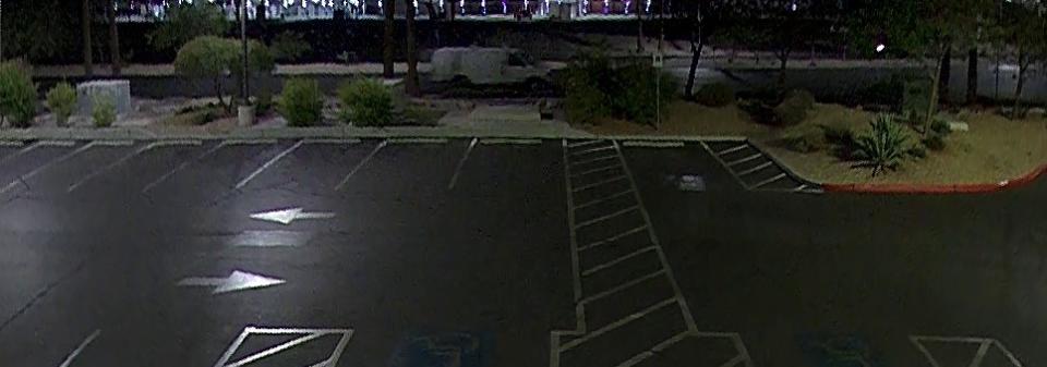 <em>A white van Nevada State Police believed may have been the fleeing vehicle, seen here on nearby security footage in the area of the crash. (Nevada State Police)</em>