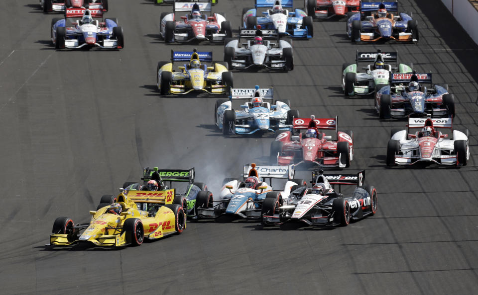 Ryan Hunter-Reay leads the field on the restart of the inaugural Grand Prix of Indianapolis IndyCar auto race at the Indianapolis Motor Speedway in Indianapolis, Saturday, May 10, 2014. (AP Photo/Darron Cummings)