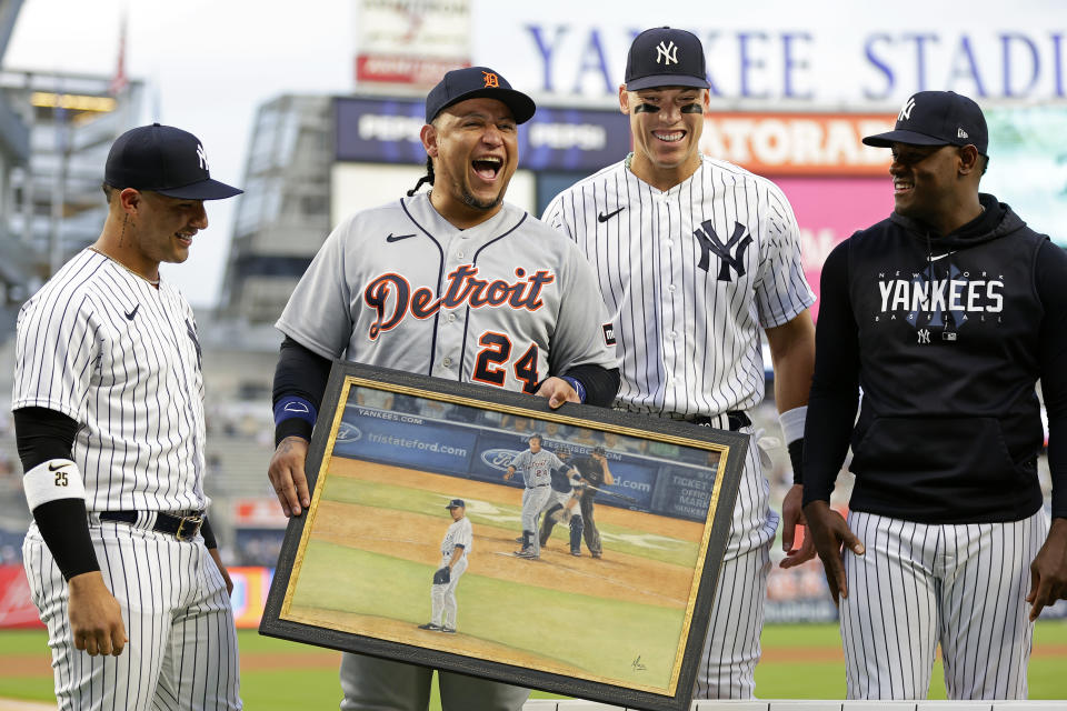 Detroit Tigers' Miguel Cabrera (24) reacts as New York Yankees' Gleyber Torres, left, Aaron Judge and Luis Severino, right, present him gifts during a pre-game ceremony before a baseball game Tuesday, Sept. 5, 2023, in New York. (AP Photo/Adam Hunger)