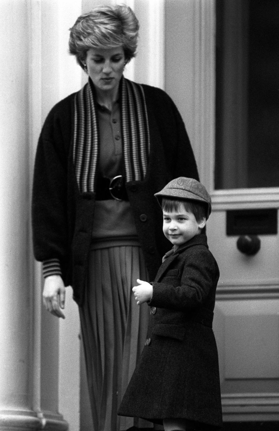 Four-year-old Prince William with his mother, the Princess of Wales, waves at onlookers before his first day at Wetherby School in Notting Hill Gate (PA) (PA Archive)