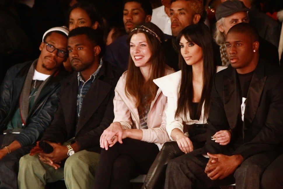 Lupe Fiasco, Kanye West, Milla Jovovich, Kim Kardashian and Reggie Bush attend Y-3 Fall 2009 during Mercedes-Benz Fashion Week at Pier 40 - West Street in West Houston Street on February 15, 2009 in New York City. 