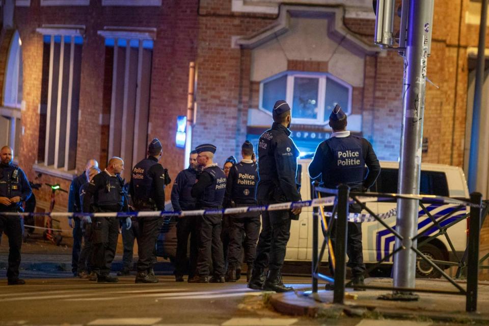 Belgium police stand at the site of a shooting incident in the Ieperlaan - Boulevard d'Ypres, in Brussels, on October 16 (Belga/AFP via Getty Images)