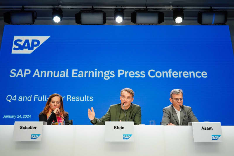(L-R) Monika Schaller, Head of Communications at the SAP software group, Christian Klein, CEO of the SAP software group, and Dominik Asam, CFO of the SAP software group, attend the annual press conference. Europe's largest software manufacturer SAP is today announcing its figures for the past financial year. Uwe Anspach/dpa
