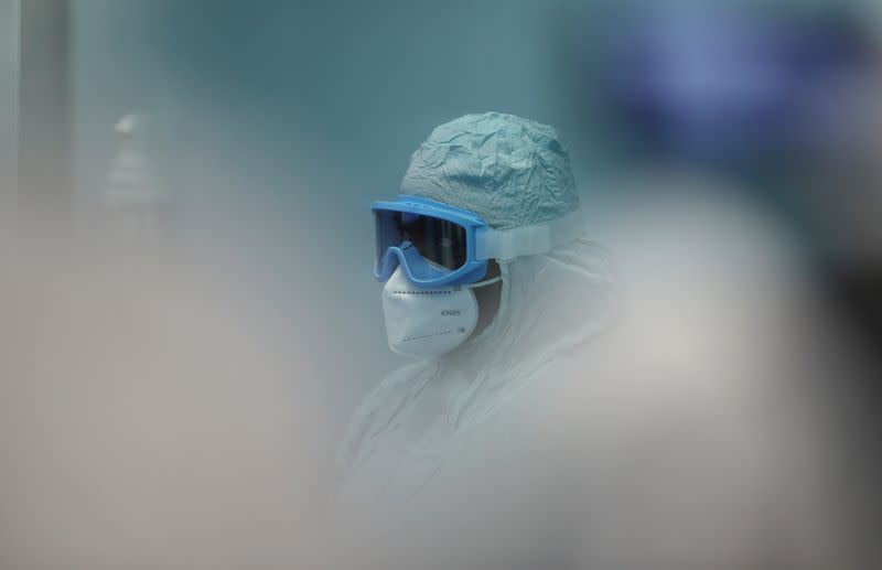 Worker at South African pharmaceutical major Aspen Pharmacare facility looks on, in Gqeberha