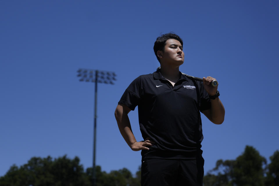 Rintaro Sasaki poses for photos at the Sunken Diamond baseball field at Stanford University in Stanford, Calif., Friday, May 31, 2024. Slugging first baseman Sasaki hit 140 high school home runs back home in Japan and opted out of the Nippon Professional Baseball draft in order to take his own unique path. He is attending college in the U.S. and will be beginning his summer ball this week in New Jersey playing for Trenton of the MLB Draft League. (AP Photo/Jeff Chiu)