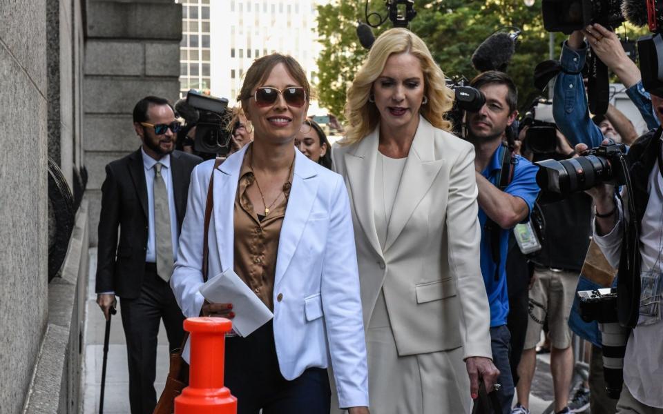 Annie Farmer (left) and her attorney Sigrid McCawley arriving at court today - Stephanie Keith/Bloomberg