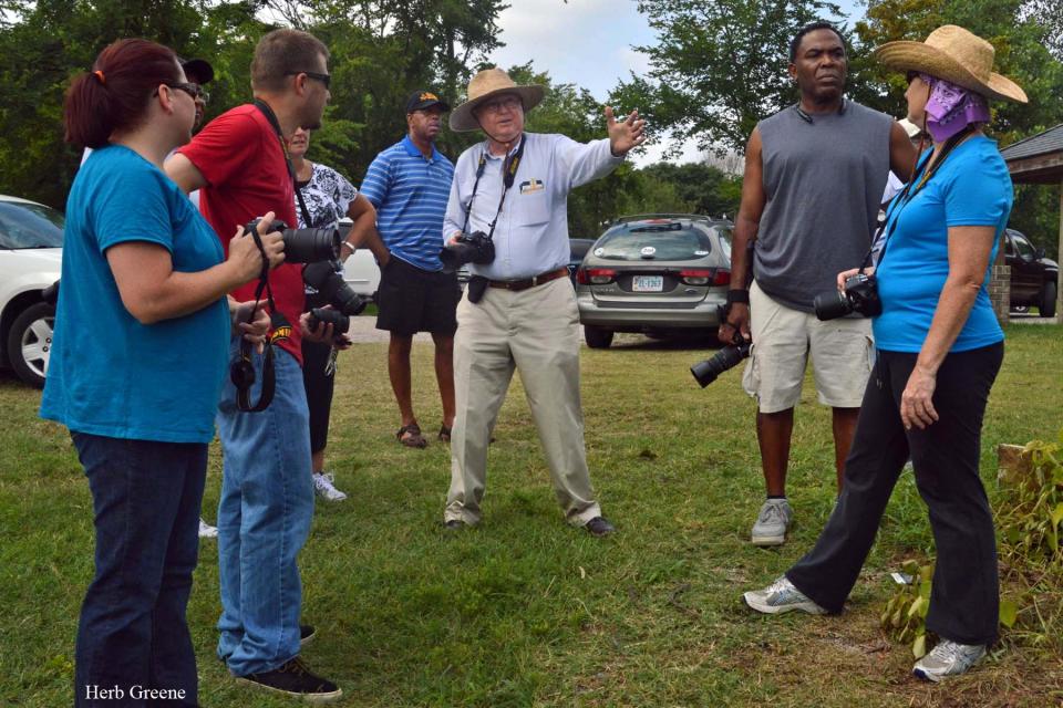 In the center, John A. Rooney Jr. speaks with Cockade City Camera Club members during an Appomattox River Trail Walk in 2014.