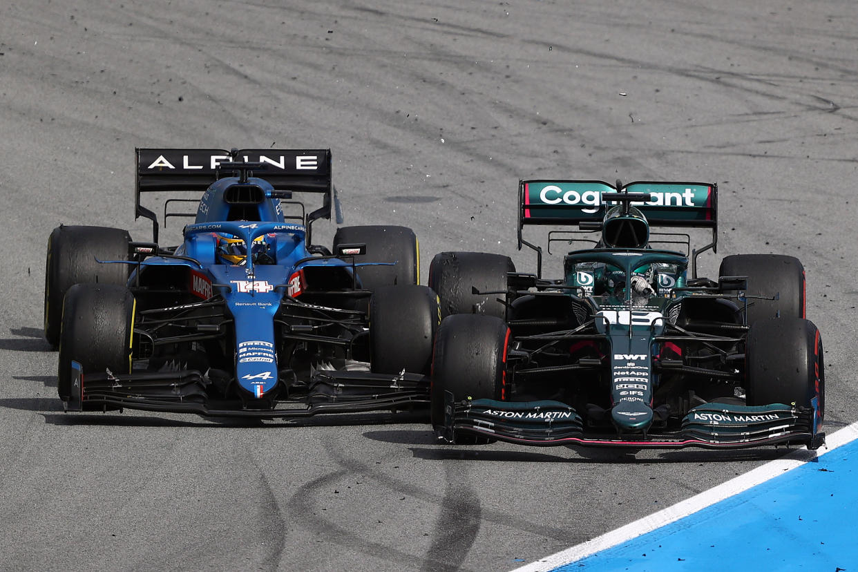 BARCELONA, SPAIN - MAY 09: Lance Stroll of Canada driving the (18) Aston Martin AMR21 Mercedes and Fernando Alonso of Spain driving the (14) Alpine A521 Renault battle for position during the F1 Grand Prix of Spain at Circuit de Barcelona-Catalunya on May 09, 2021 in Barcelona, Spain. (Photo by Bryn Lennon/Getty Images)