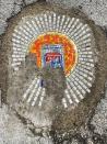 Chicago artist Jim Bachor creates four pandemic-themed pothole mosaics on the city's North Side