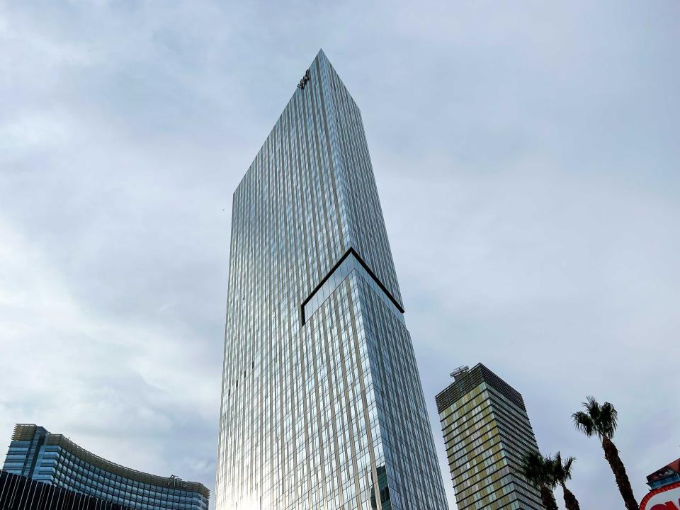 A view looking up at a tall skyscraper building.