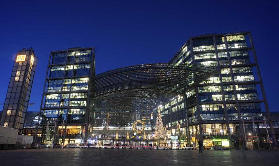 Offices and shops inside the main railway station are illuminated in Berlin, Germany, Tuesday, Jan. 9, 2024. (AP Photo/Michael Sohn)