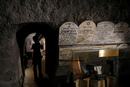 Gravestones commemorating the Jewish villages and towns whose communities were wiped out by the Nazis, are seen on a wall inside "The Chamber of the Holocaust", a little-known memorial site for Jewish victims of the Nazi Holocaust, in Jerusalem's Mount Zion January 23, 2019. REUTERS/Ronen Zvulun