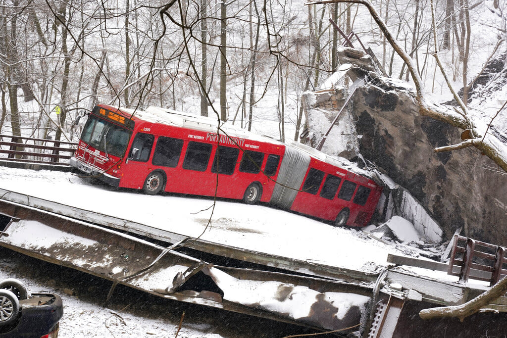 A Pittsburgh Transit Authority bus was on the Fern Hollow Bridge in Pittsburgh when it collapsed Friday morning. (AP Photo/Gene J. Puskar)