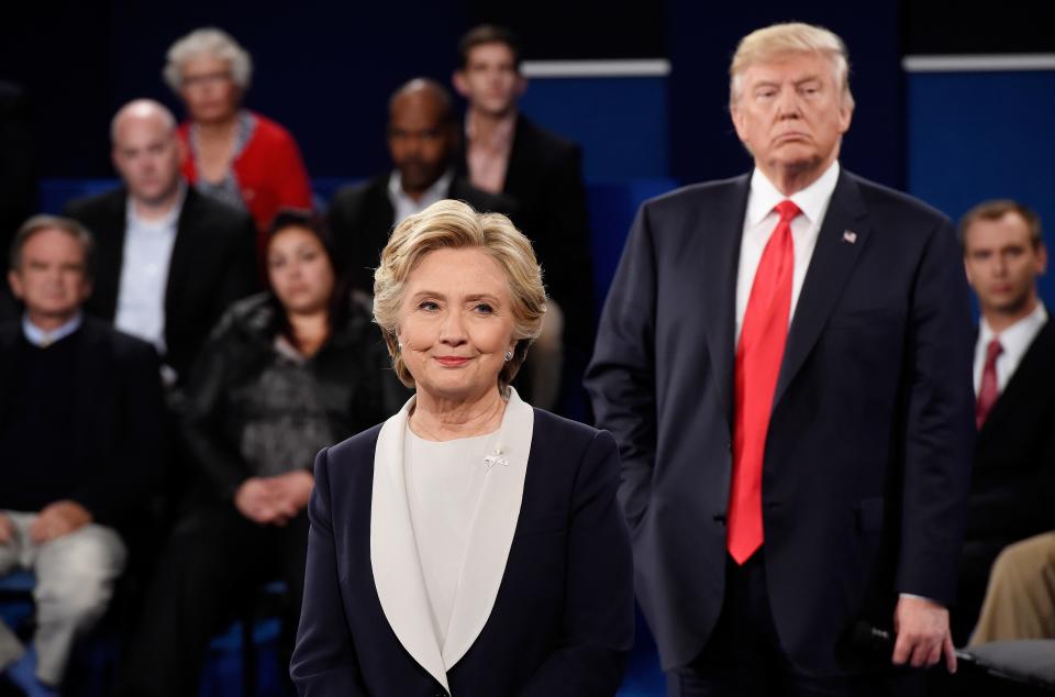 Hillary Clinton and Donald Trump listen during the town hall debate at Washington University in October 2016 in St Louis, Missouri.