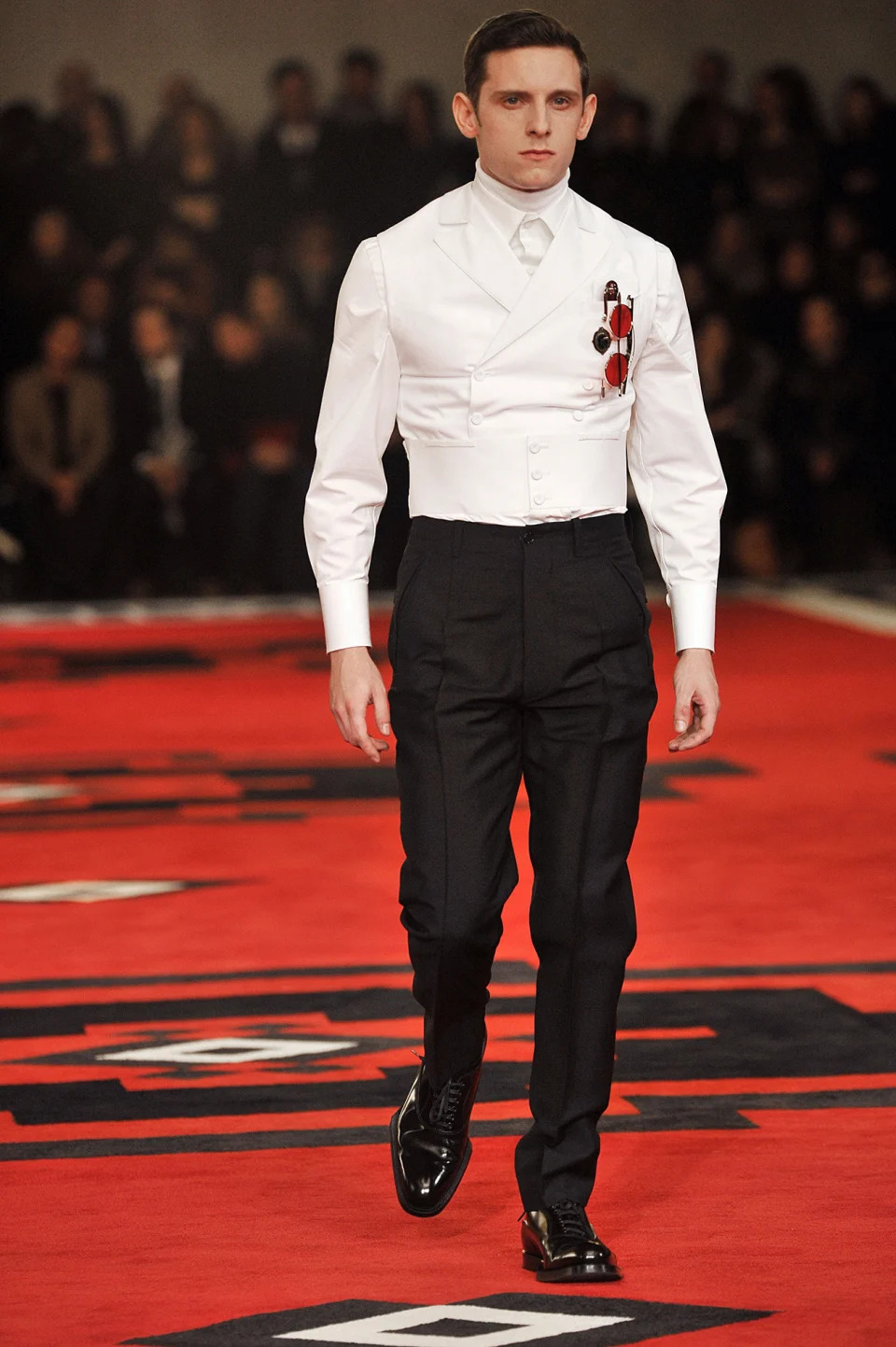 prada villains fashion show runway, MILAN, ITALY - JANUARY 15: Actor Jamie Bell walks the runway during the Prada ready to Wear Fall/Winter 2012 - 2013 show as part of the  Milan Men Fashion Week on January 15, 2012 in Milan, Italy. (Photo by Victor VIRGILE/Gamma-Rapho via Getty Images)