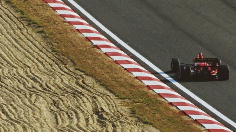 A photo of the rear end of the Life Racing F1 car as it drives in Hungary. 