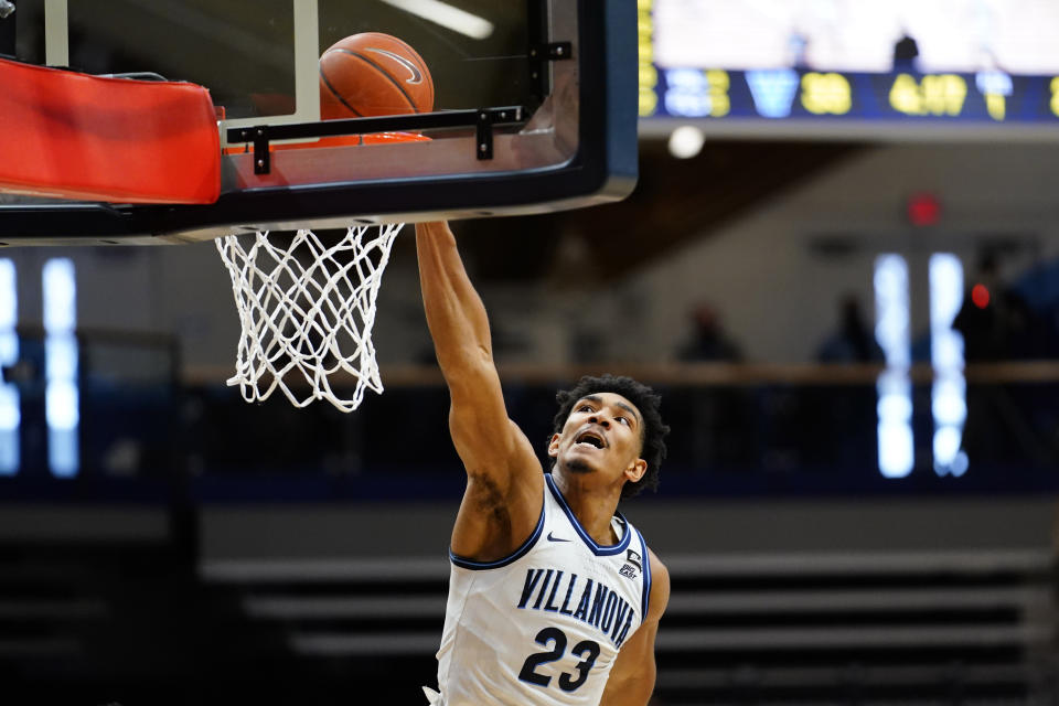 Villanova's Jermaine Samuels dunks the ball during the first half of an NCAA college basketball game against Georgetown, Sunday, Feb. 7, 2021, in Villanova, Pa. (AP Photo/Matt Slocum)