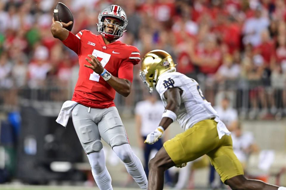 Ohio State quarterback C.J. Stroud throws while being pressured by Notre Dame safety DJ Brown during the second quarter of their game at Ohio Stadium, Saturday, Sept. 3, 2022, in Columbus, Ohio.