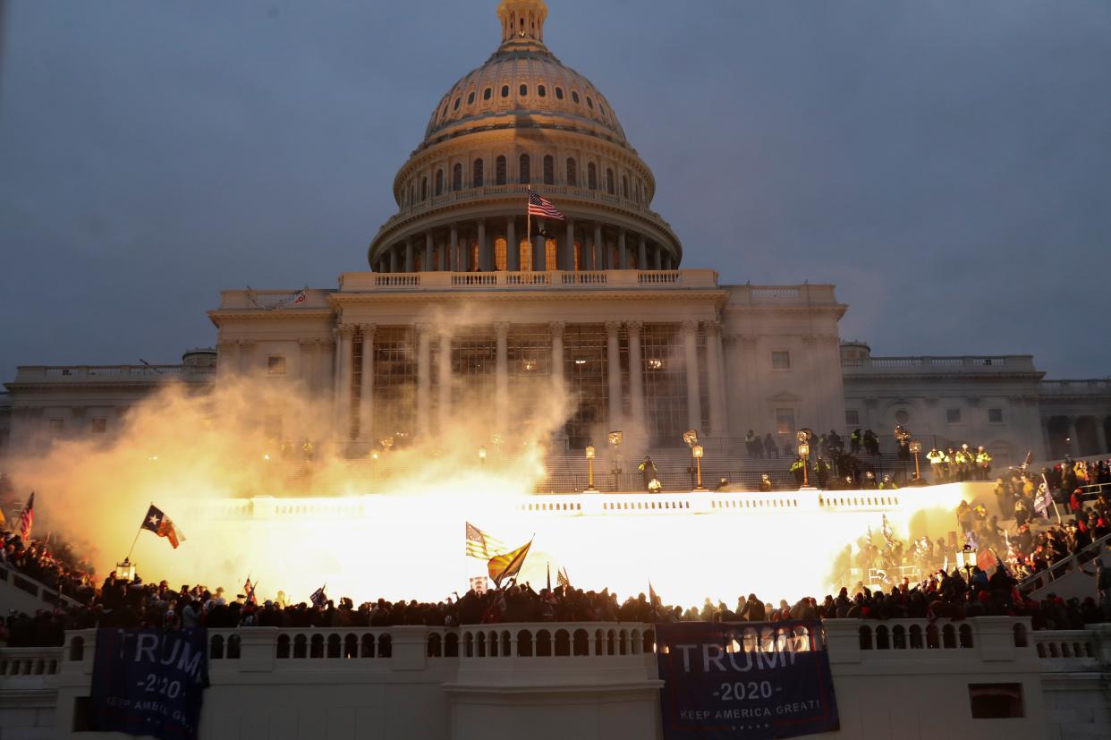 <p>A dramatic explosion is caught on camera outside of the Capitol building amid pro-Trump riots </p> (REUTERS)