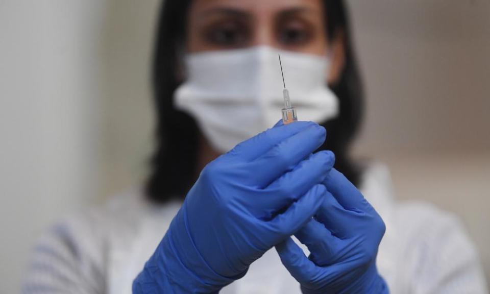 Health worker with syringe