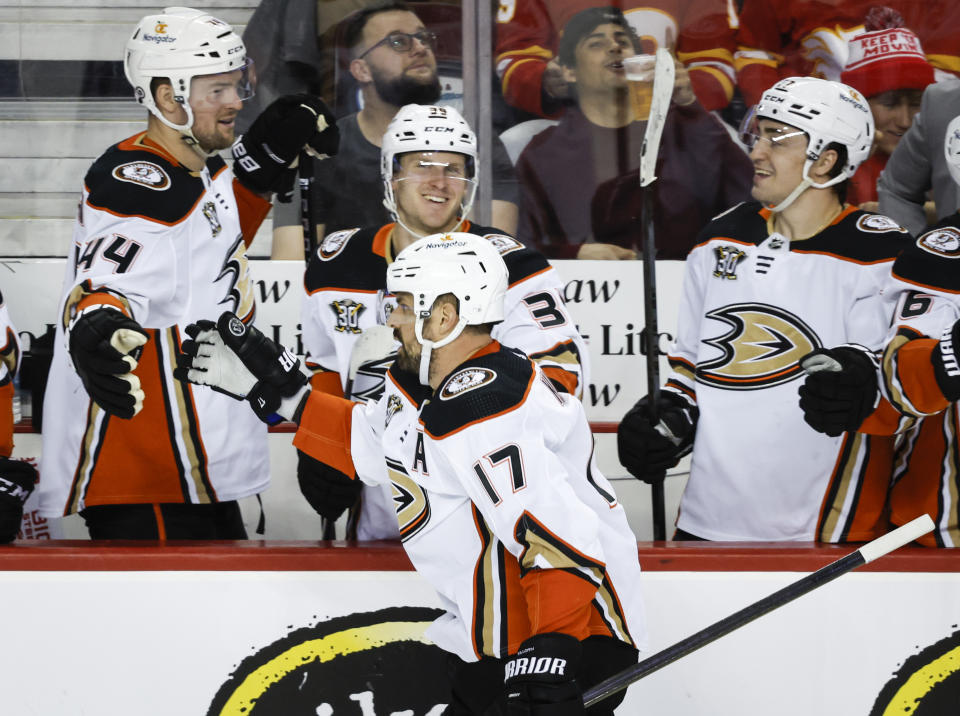 Anaheim Ducks forward Alex Killorn (17) is congratulated for a goal against the Calgary Flames during the third period of an NHL hockey game Tuesday, April 2, 2024, in Calgary, Alberta. (Jeff McIntosh/The Canadian Press via AP)