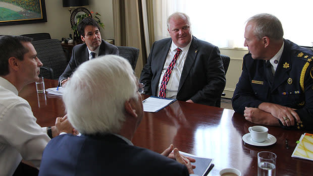 Ontario Premier Dalton McGuinty, left, meets with Toronto Mayor Rob Ford, second from right, to discuss gun violence. Flanking Ford are Minister of Children and Youth Services Eric Hoskins on the left and Toronto police Chief Bill Blair. Ontario Attorney General John Gerretsen is in the foreground.