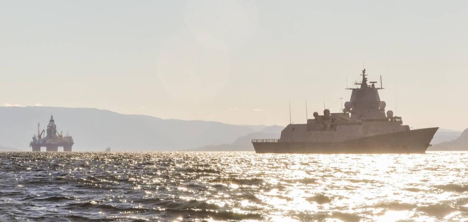 One of Norway's <em>Fridtjof Nansen</em> class frigates sails near an offshore platform in the North Sea in late 2022. <em>Forsvaret</em>