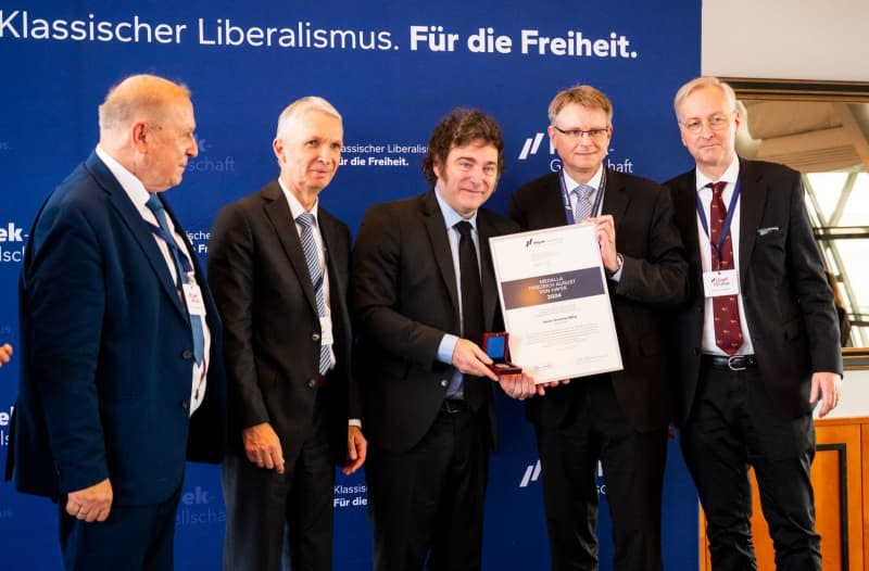 Argentinian President Javier Milei (C) is awarded the Hayek Medal of the Friedrich August v. Hayek Society by (L-R) Gerd Habermann, Executive Director of the Hayek Society, Gerhard Papke Treasurer, Stefan Kooths, Chairman, and Carlos Gebauer, Deputy Chairman. Daniel Bockwoldt/dpa