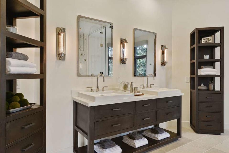 The master bathroom has a steam shower, a BainUltra therapeutic tub, and closets by California Closets.