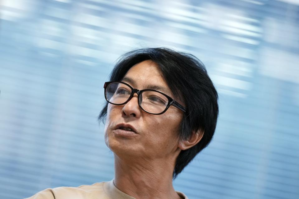 Junya Hiramoto, head of Johnny's Sexual Assault Victims Association speaks during an interview with The Associated Press Monday, Sept. 4, 2023, in Tokyo. A group of men who say they were sexually abused by a Japanese boy band producer expressed hope Monday that the company will agree to provide financial compensation and introduce measures to prevent a recurrence. (AP Photo/Eugene Hoshiko)