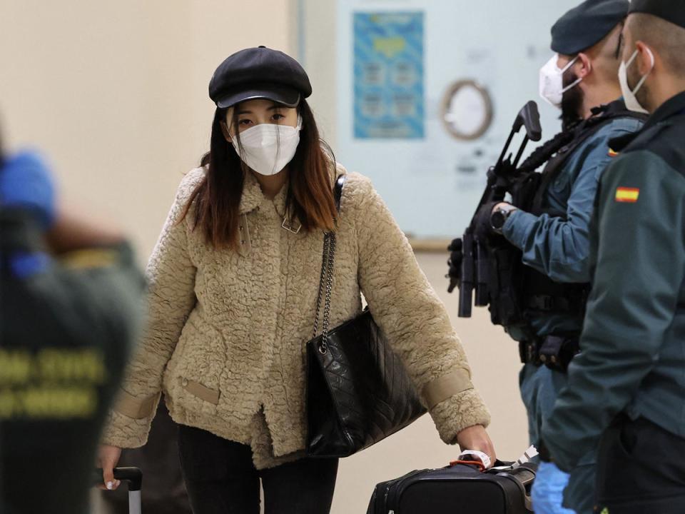 A passenger from Beijing leaves the terminal at Adolfo Suarez Madrid-Barajas airport in Madrid (AFP/Getty)