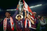 FILE PHOTO: Ajax Amsterdam's Edgar Davids lifts the Champions League trophy aloft as he celebrates with Finidi George, Jari Litmanen and Nwankwo Kanu after they beat AC Milan in the final in Vienna.