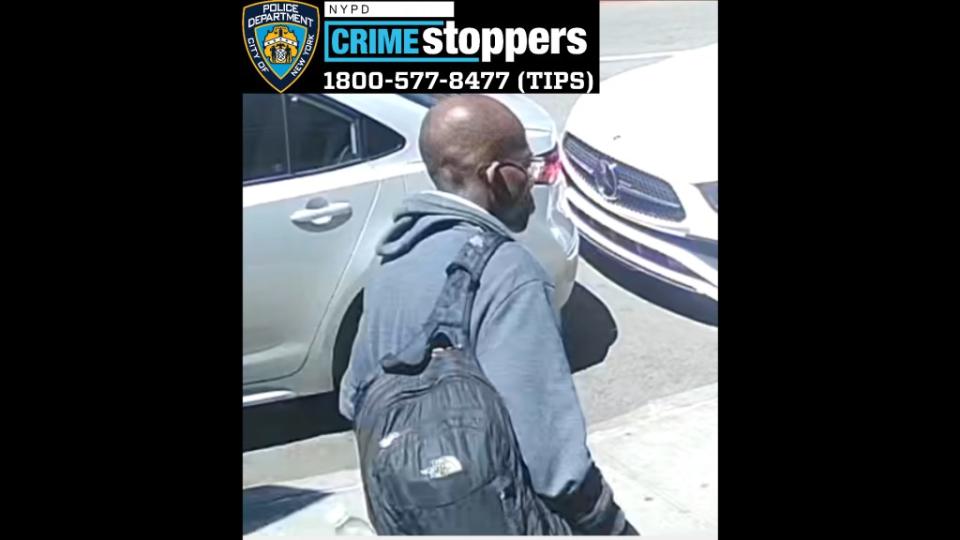 The attacker, seen walking on the sidewalk in NYPD surveillance footage, remains on the loose. NYPD