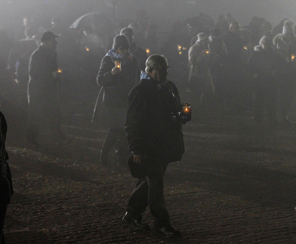 File - In this Saturday, Jan. 27, 2018 file photo, survivors of the Nazi death camp Auschwitz arrive for a commemoration ceremony on International Holocaust Remembrance Day at the International Monument to the Victims of Fascism inside Auschwitz-Birkenau in Oswiecim, Poland. The commemorations for the victims of the Holocaust at the International Holocaust Remembrance Day, marking the liberation of Auschwitz-Birkenau on Jan. 27, 1945, will be mostly online this year due to the coronavirus pandemic. (AP Photo/Czarek Sokolowski, file)