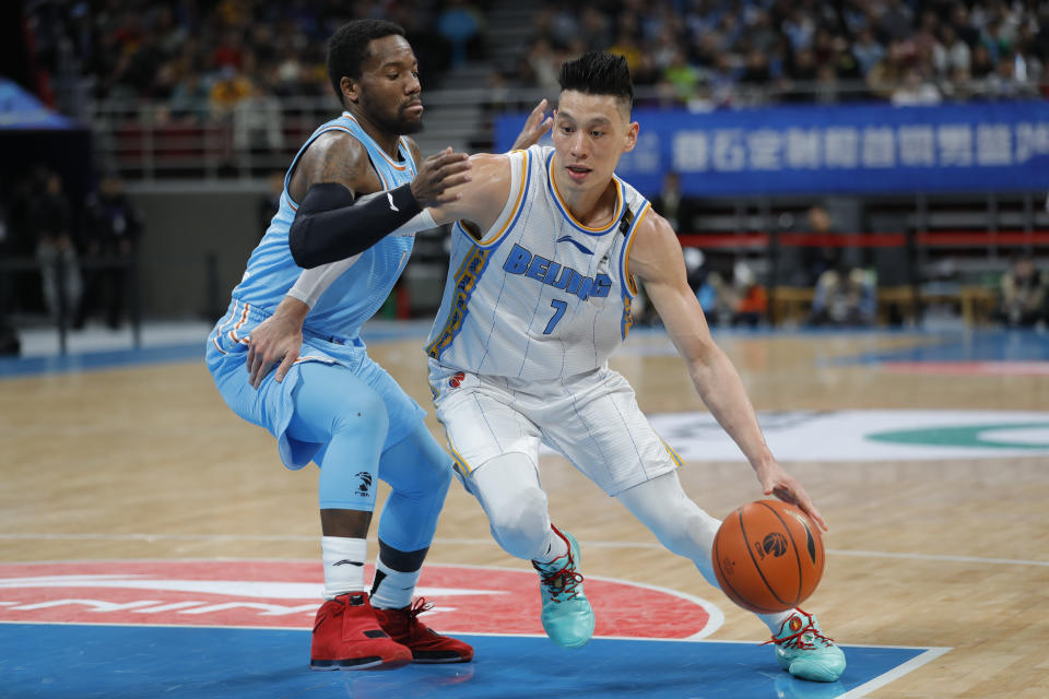 Jeremy Lin of the Beijing Ducks and Kay Felder of the Xinjiang Yilite in action during at Beijing Wukesong Sport Arena on December 25, 2019 in Beijing, China.