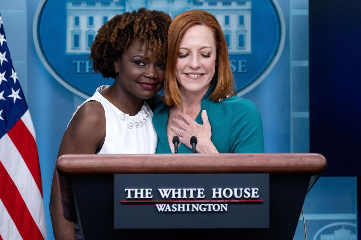 White House Press Secretary Jen Psaki (R) is hugged by current Principal Deputy Press Secretary Karine Jean-Pierre during a press briefing in the Brady Press Briefing Room of the White House in Washington, DC, May 5, 2022, after it was announced Psaki would step down from her role next week and be replaced by Jean-Pierre. - US President Joe Biden on May 5, 2022 named Karine Jean-Pierre as the next White House press secretary, the first Black woman to hold the high-profile post. Jean-Pierre, who will also be the first openly LGBTQ+ person in the role, will replace Jen Psaki, under whom she served as deputy, from May 13, according to a White House statement.