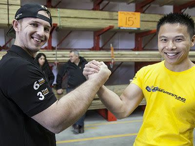 Matthias Schlitte, left, is a professional arm wrestler. PIC: Visualeyes Photography Sydney