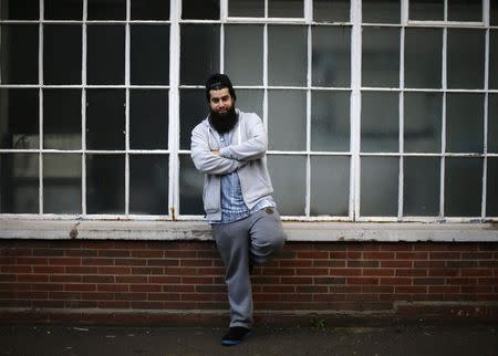 Waseem Iqbal poses for a photograph in Birmingham, central England November 20, 2014. REUTERS/Darren Staples