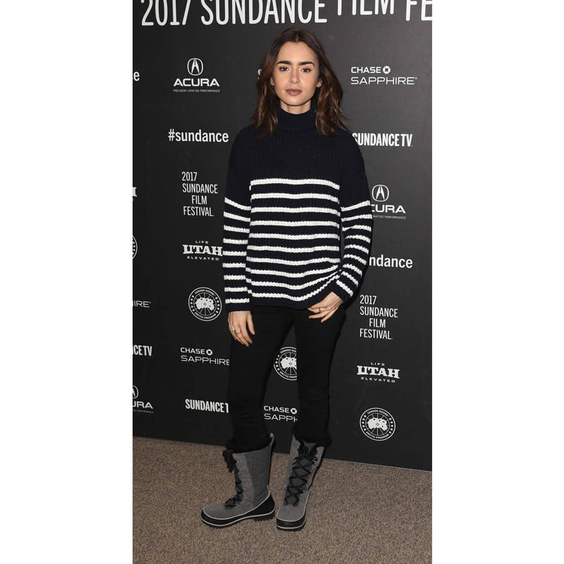 <p>An oversize striped knit instantly dresses up winter boots and black skinnies, as illustrated by Lily Collins.</p> <h4>Getty Images</h4>