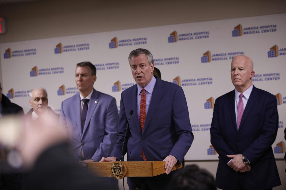 New York Mayor Bill de Blasio speaks during a press conference at Jamaica Hospital Medical Center Tuesday, Feb. 12, 2019, in the Queens borough of New York. An NYPD detective and an NYPD sergeant were shot while responding to an armed robbery at a T-Mobile store in Queens. (AP Photo/Kevin Hagen).