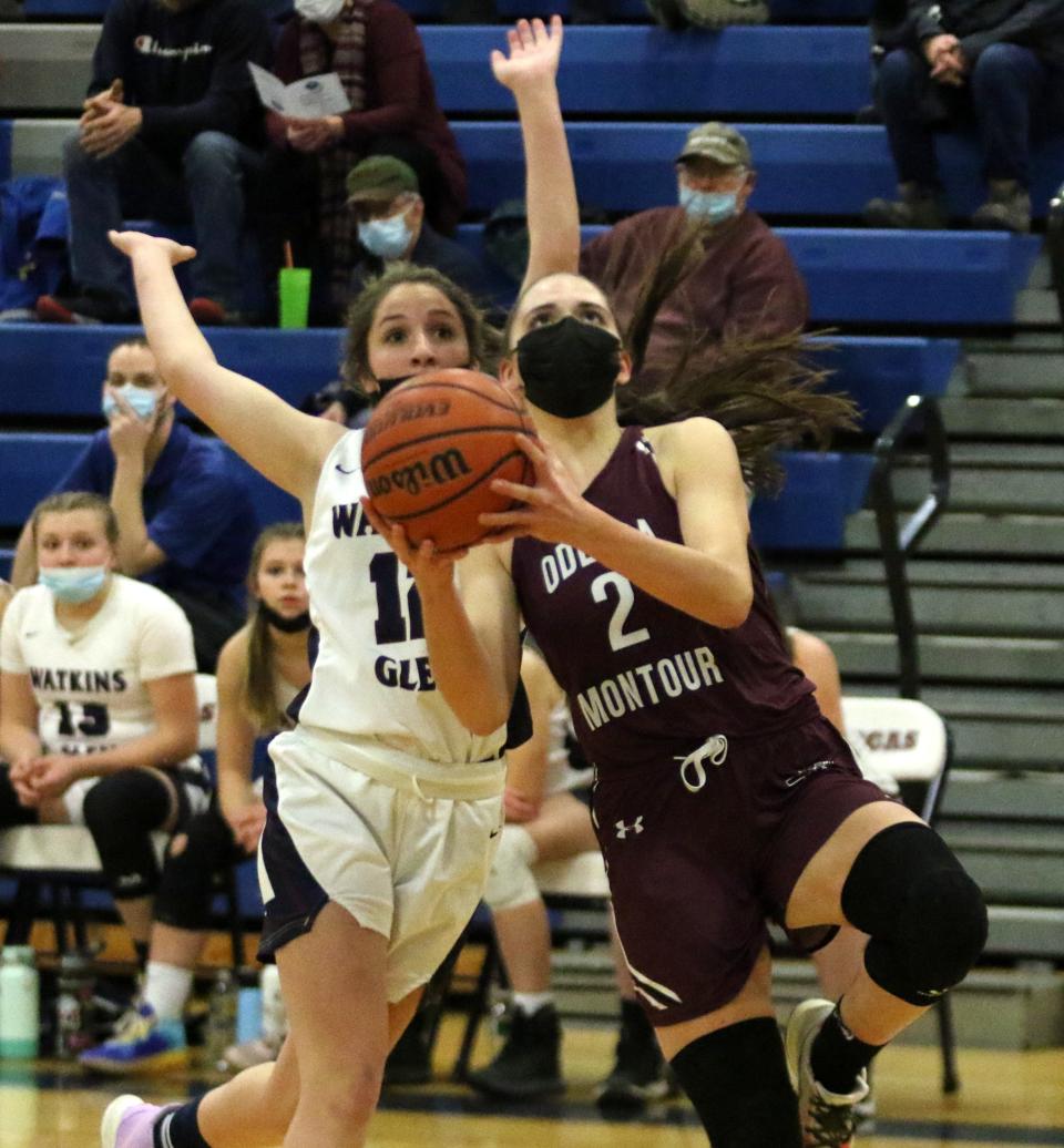 Odessa-Montour's Hannah Nolan goes in for a layup in front of Watkins Glen's Lillian Ameigh during O-M's 51-45 overtime win in girls basketball Jan. 20, 2022 at Watkins Glen High School's field house.