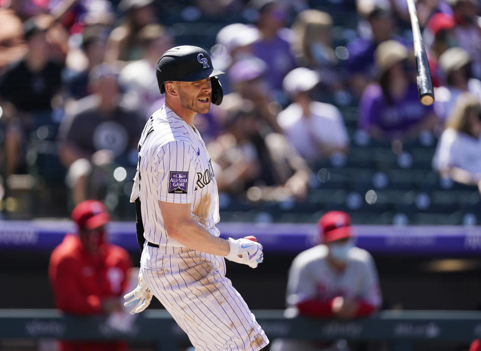 Colorado Rockies' Trevor Story flips his bat after hitting a grand slam off Philadelphia Phillies relief pitcher David Hale in the fourth inning of a baseball game Sunday, April 25, 2021, in Denver. (AP Photo/David Zalubowski)