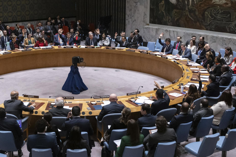 Representatives of member countries take vote during the Security Council meeting at United Nations headquarters, Friday, Dec. 22, 2023. After many delays, the U.N. Security Council adopted a watered-down resolution Friday calling for immediately speeding up aid deliveries to desperate civilians in Gaza but without the original call for an “urgent suspension of hostilities” between Israel and Hamas. (AP Photo/Yuki Iwamura)