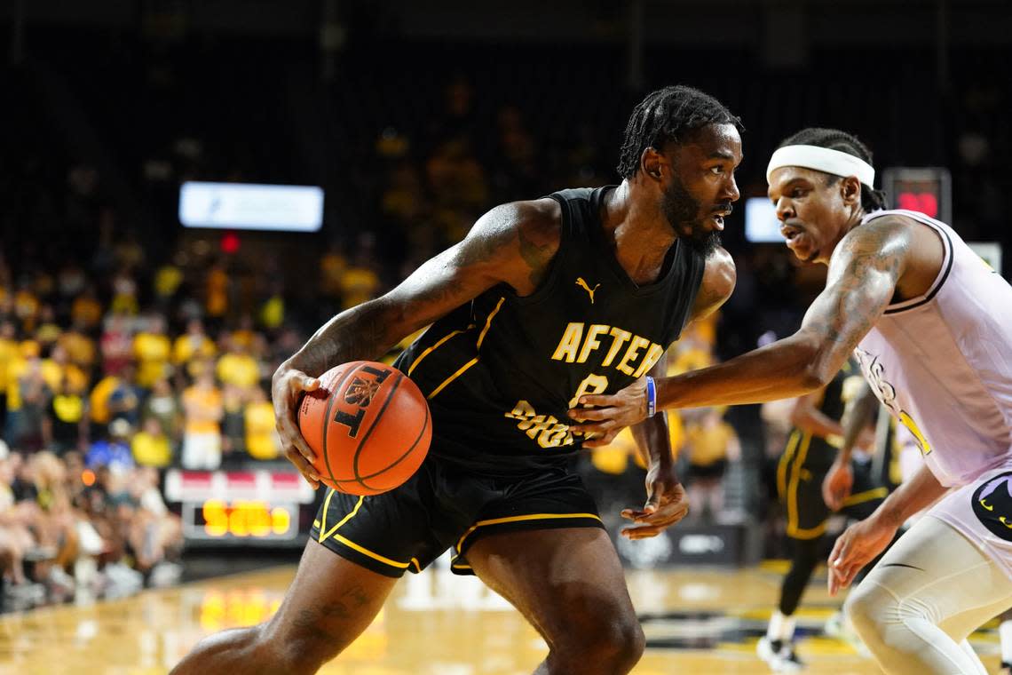 Rashard Kelly drives to the basket for the AfterShocks in their game at Koch Arena during The Basketball Tournament.