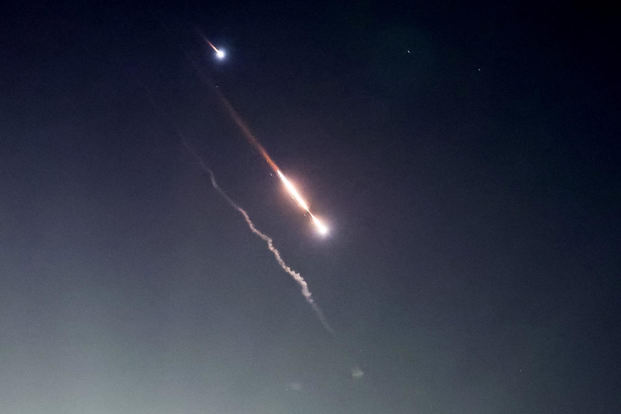 <span>Projectiles are seen in the sky above Jerusalem after Iran launched drones and missiles towards Israel. US and UK forces helped shoot down Iranian drones in the Middle East early on Sunday.</span><span>Photograph: Ronen Zvulun/Reuters</span>